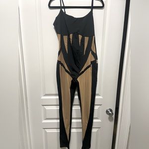 Jumpsuit with sheer accents.